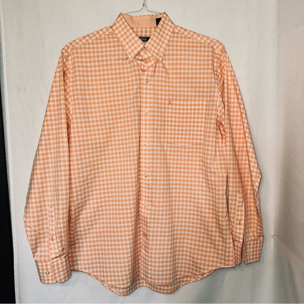 Medium long sleeve IZOD NWOT 55% cotton 45% polyester. Peach & white checkered.